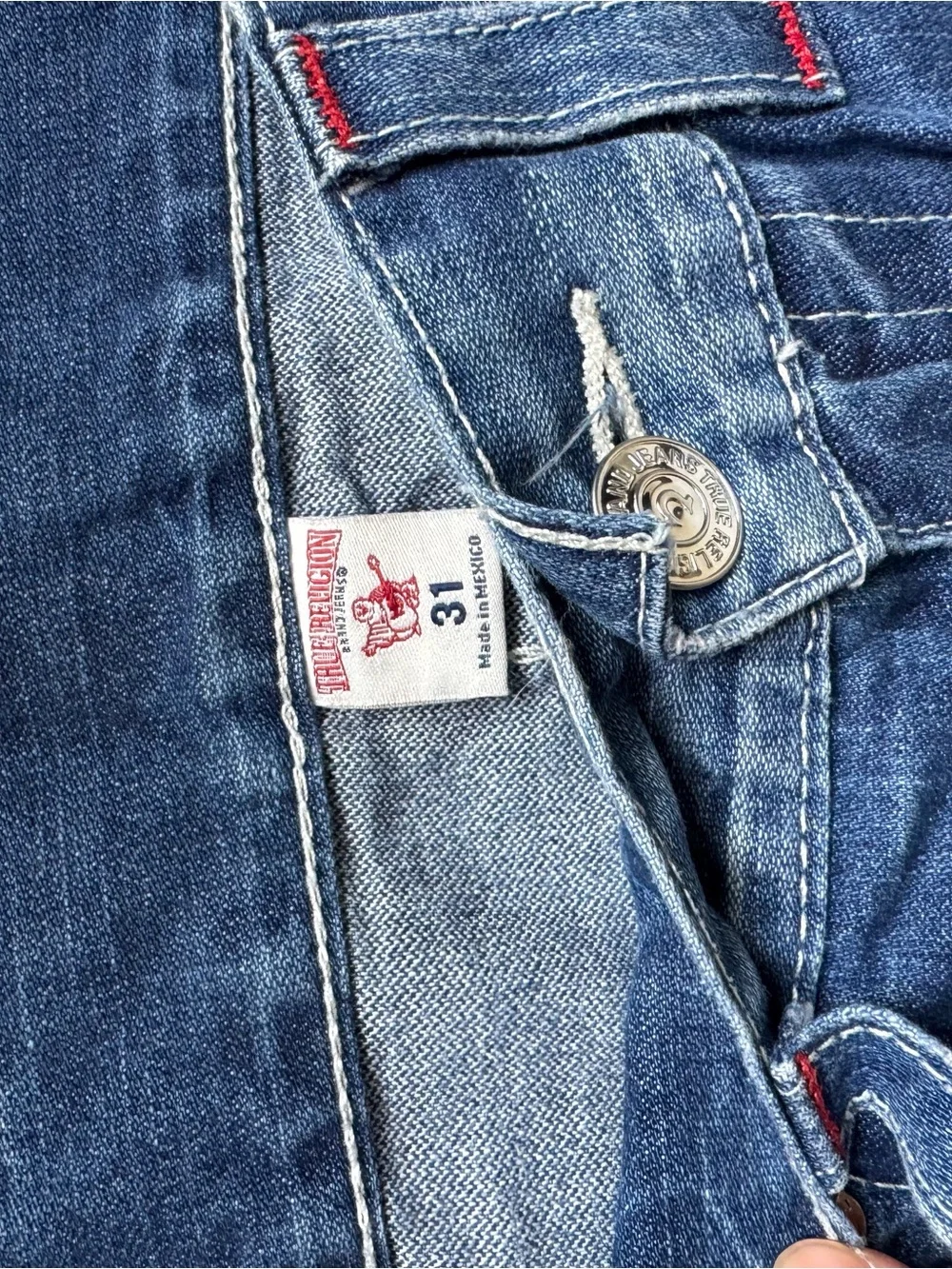 True Religion medium blue denim cutoff shorts with red logo patch